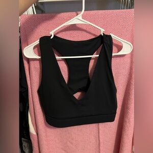 black fabletics sports bra with phone pocket
